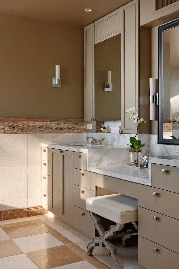 makeup vanity table with lighted mirror, beige drawers, marble countertop, white leather stool