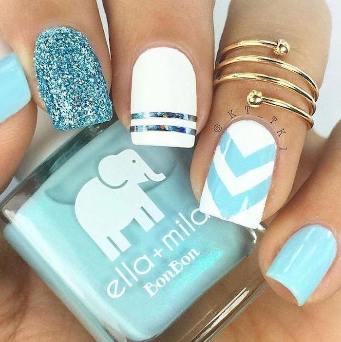 white and blue, blue glitter, nail polish, classy nail designs, gold ring, nail polish bottle