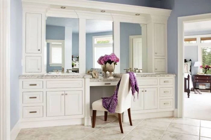 large mirror, white cupboards and drawers, vanity mirror with lights for bedroom, white chair