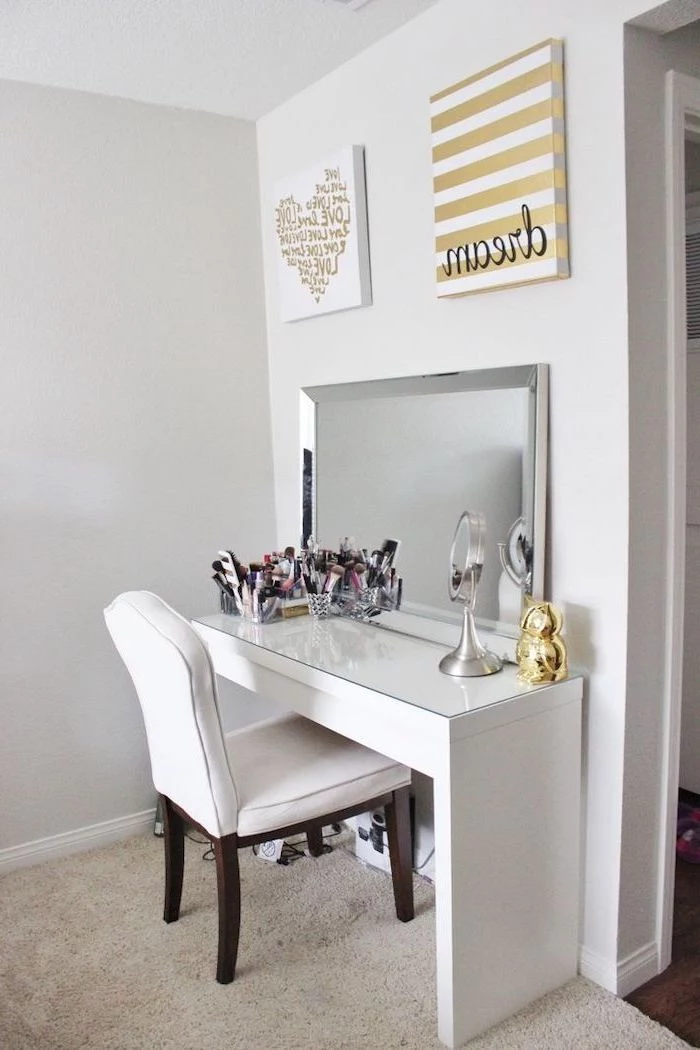 white chair, white table, vanity mirror with lights for bedroom, white walls, beige carpet