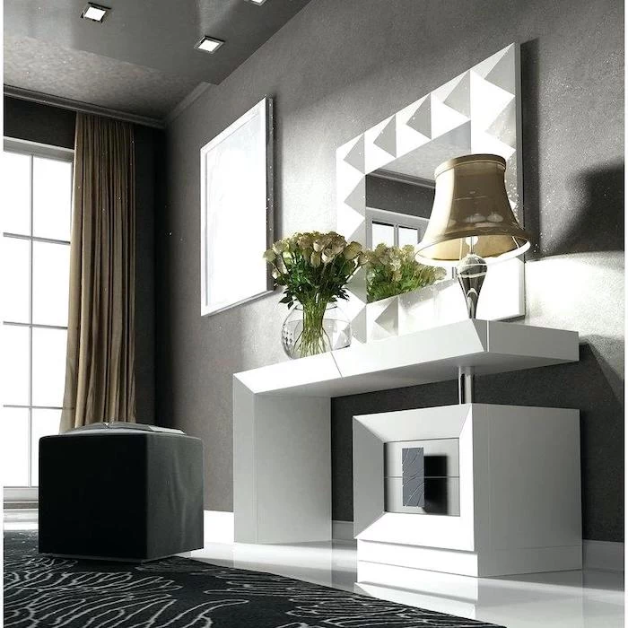 grey walls, black leather ottoman, white shelf, modern makeup vanity, black carpet