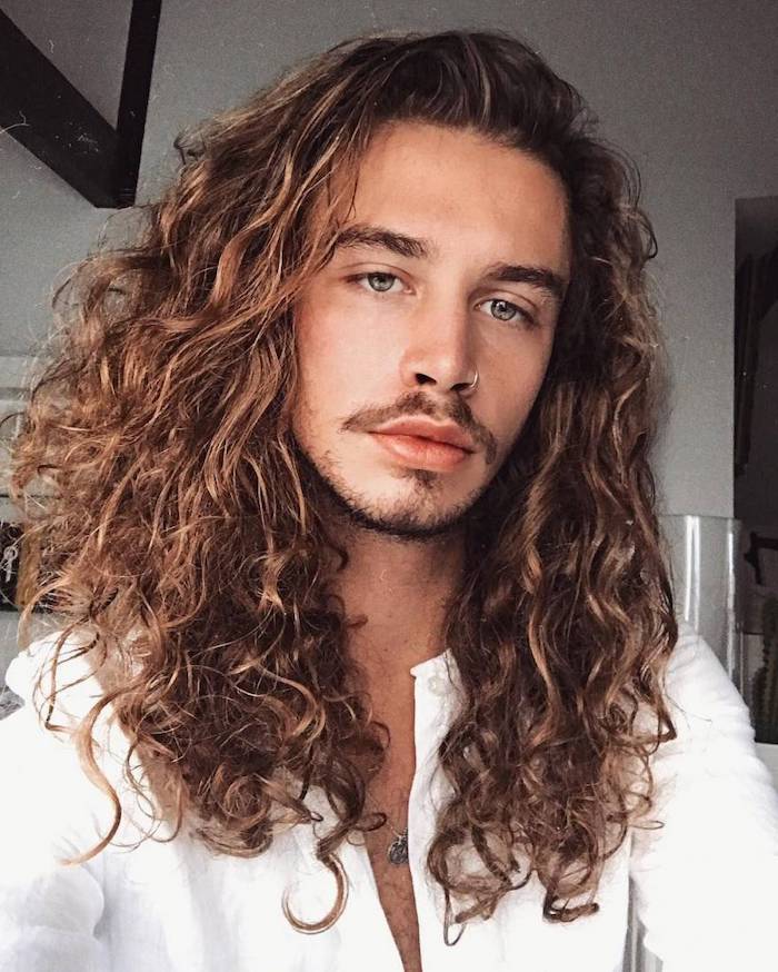 dark brown curly hair guy