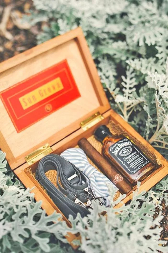 wooden box, suspenders an bow tie, whiskey and cigar, groomsmen gift sets, blurred background