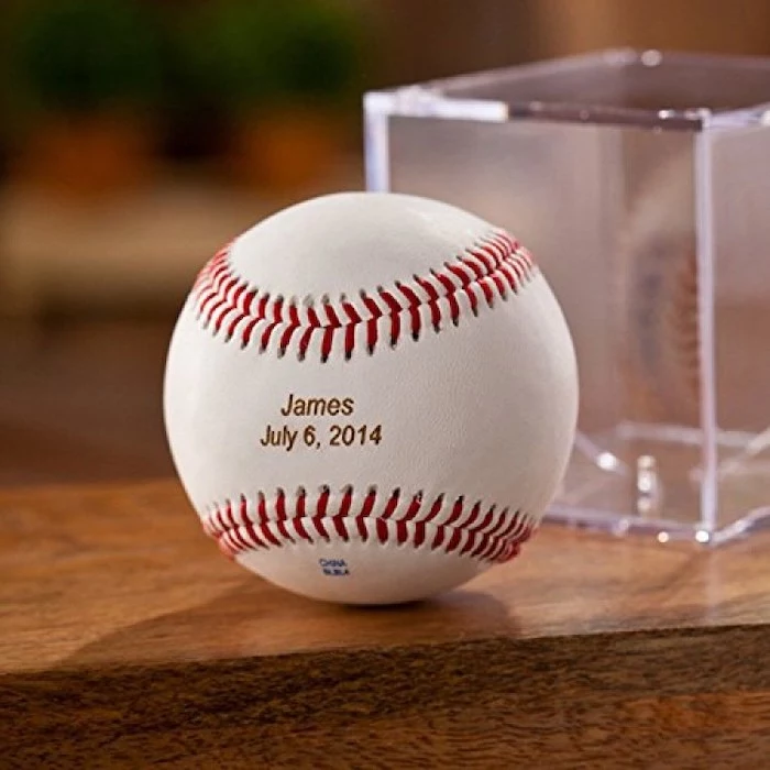 how to ask groomsmen, baseball engraved with name and date, on a wooden table