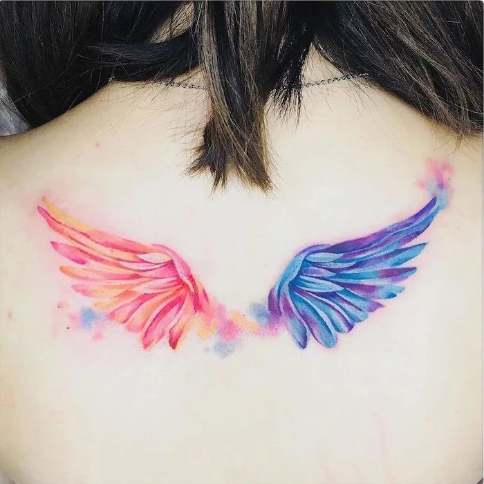 watercolor tattoo, back tattoo, angel wings tattoo, blue and purple wing, orange and pink wing