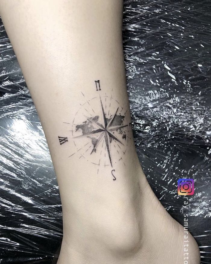 nautical compass tattoo, map of the world, ankle tattoo, north and south, east and west