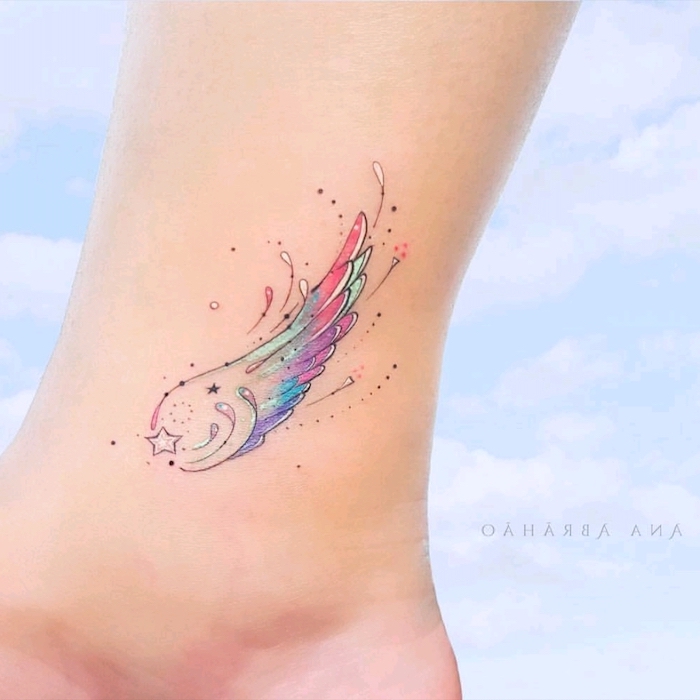 watercolor tattoo, guardian angel tattoo, blue background, colors of the rainbow, ankle tattoo
