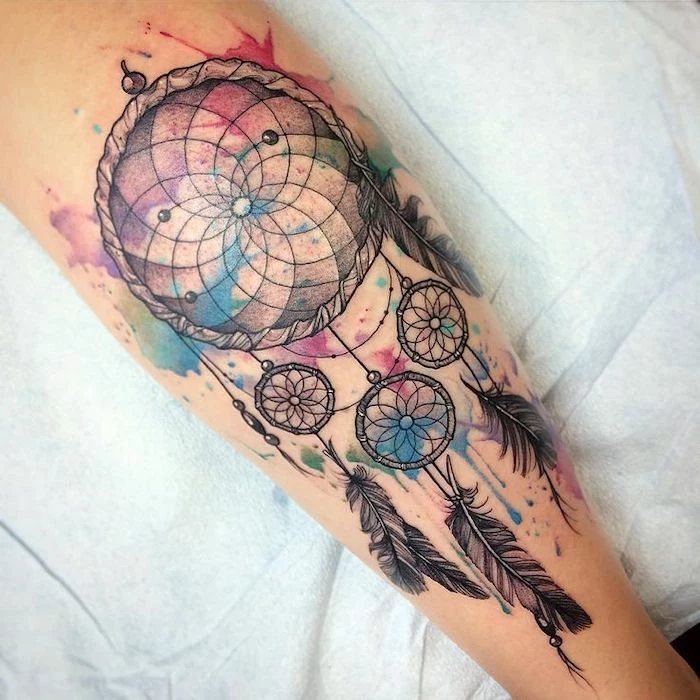 dream catcher tattoo, watercolor tattoo, back of leg, on white sheet of paper