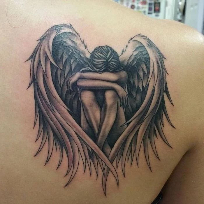 female angel, sitting and covering her face, guardian angel tattoo, shoulder tattoo