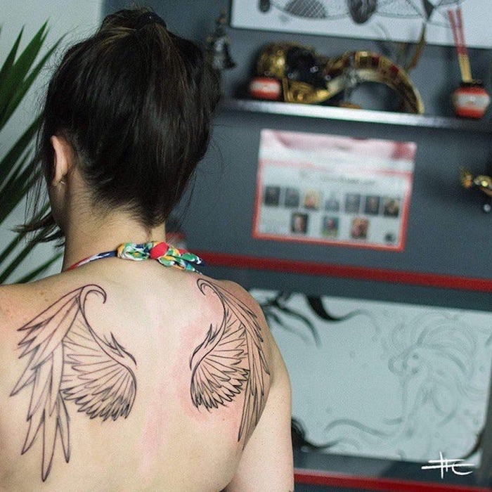 back tattoo, angel wings, heaven tattoos, woman with black hair, blurred background