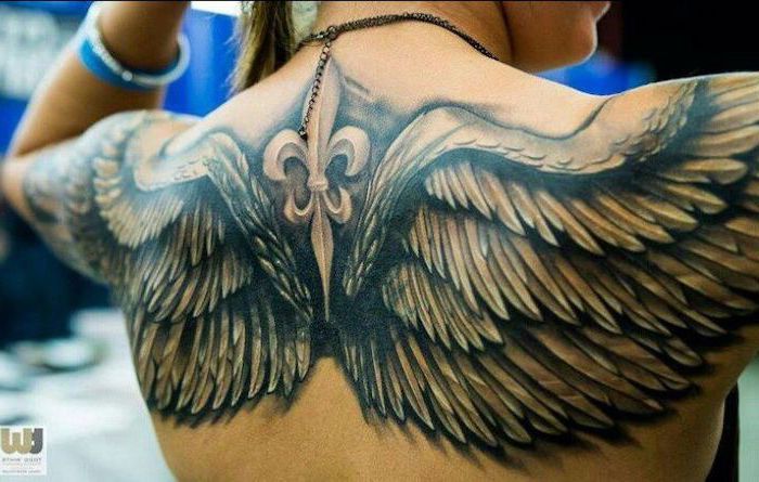 back tattoo, heaven tattoos, blurred background, angel wings, extending to the arms