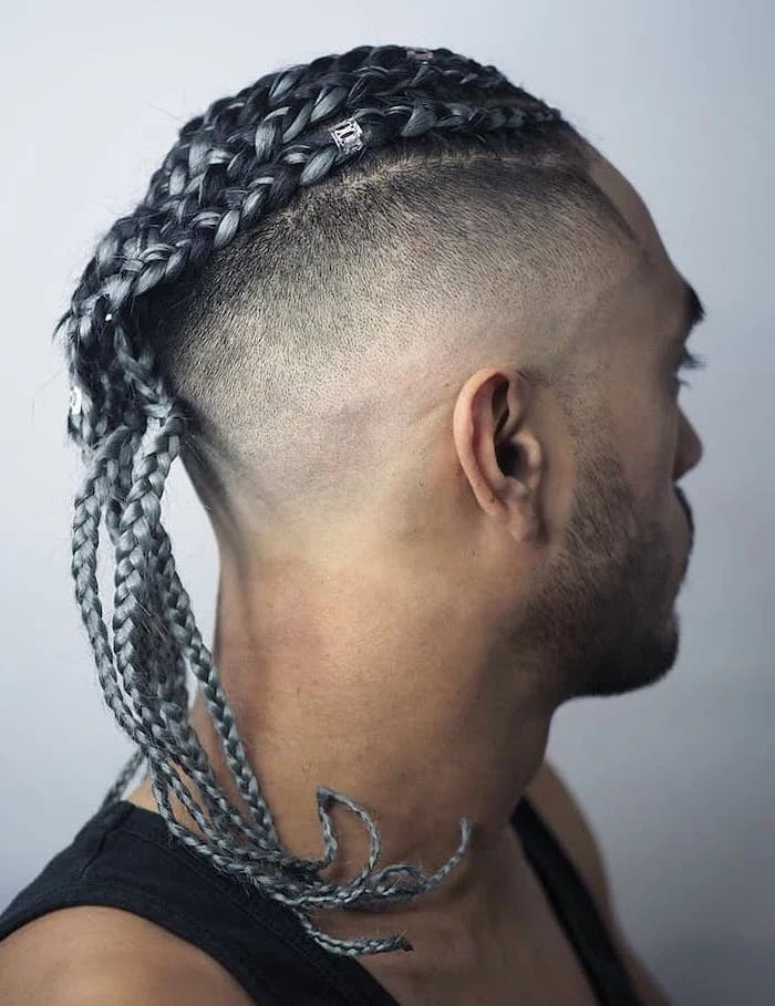 man with an undercut, black top, black hair, with ash gray highlights, braids for men