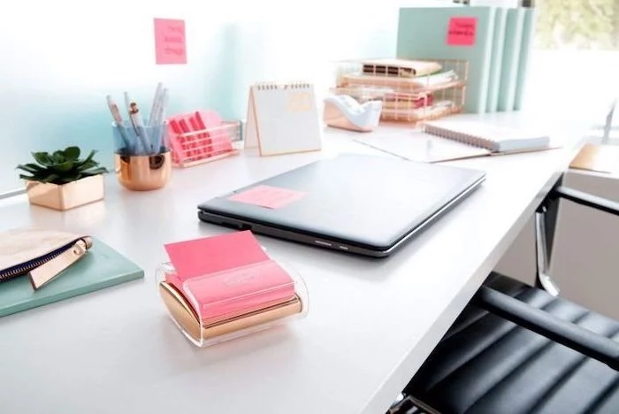 black leather chair, white desk, gold desk accessories, cubicle decor ideas, business card holder