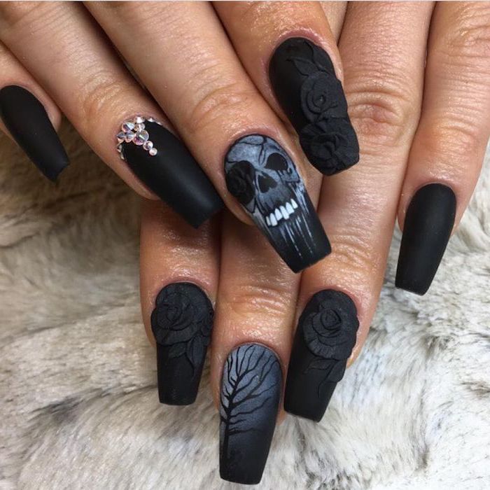 nail ideas, black matte nail polish, skulls and roses, trees decorations, silver rhinestones