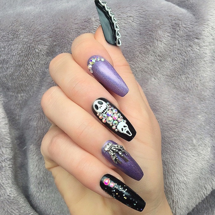 purple glitter, black nail polish, halloween nail designs, skulls and chains decorations, silver rhinestones