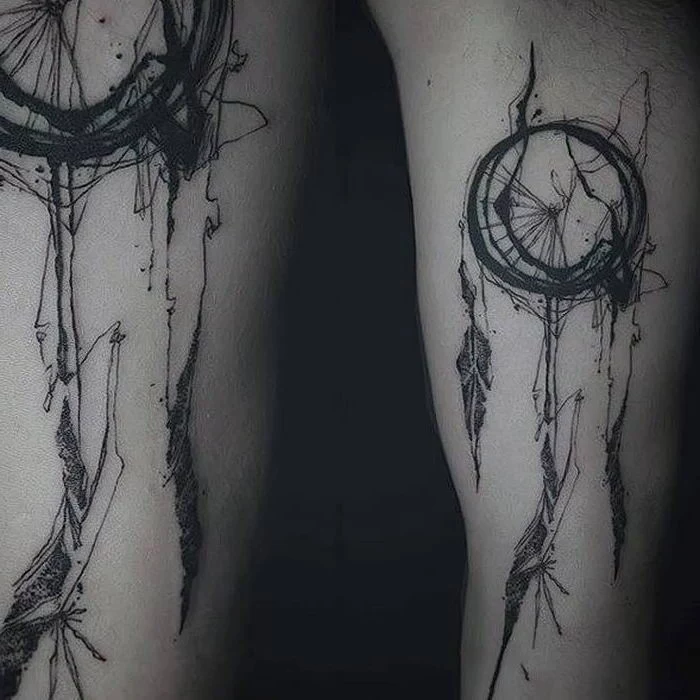 black and white photo, forearm tattoo, dreamcatcher tattoo meaning, intricate design