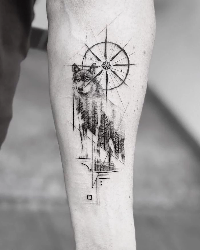black and white photo, compass tattoo meaning, wolf tattoo, forearm tattoo, geometric design