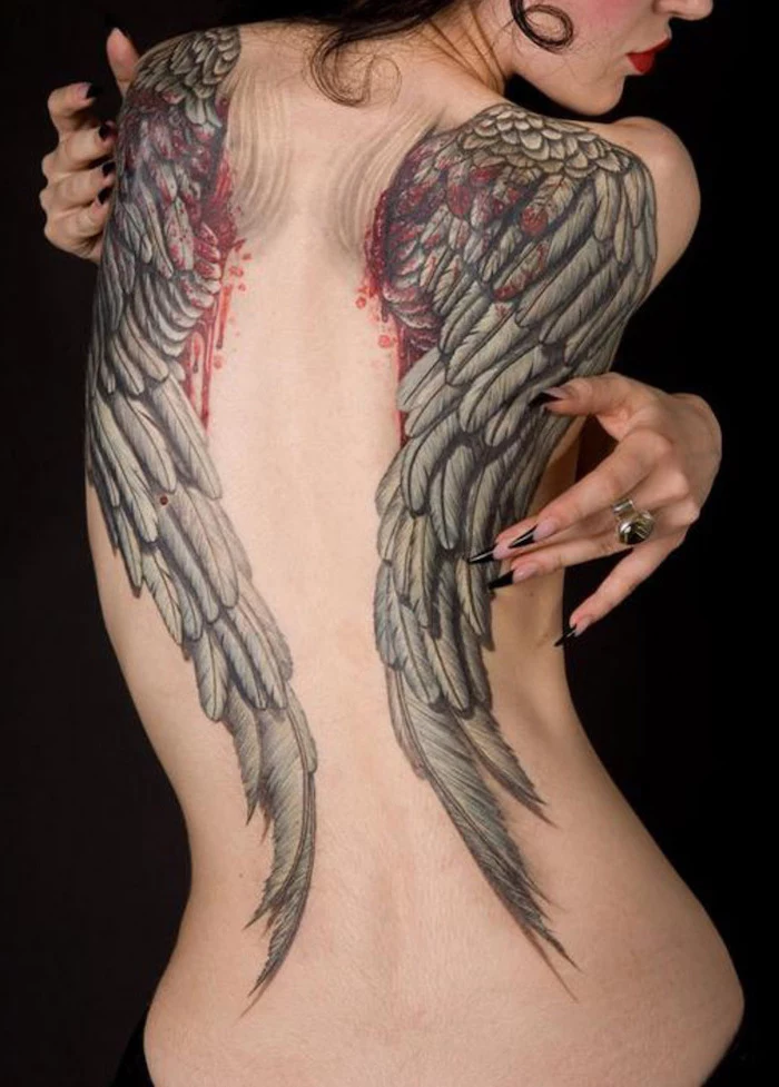 fallen angel tattoo, back tattoo, bleeding wings, woman with long, black nails, black background