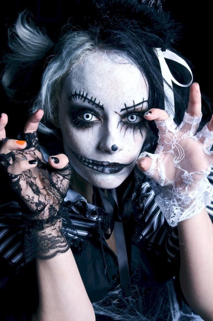 woman with scary make up, blue contact lenses, cute halloween costumes, white and black, lace gloves