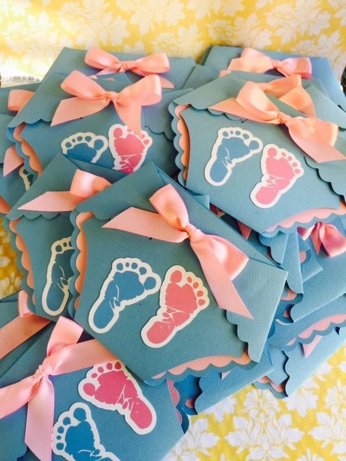 gender reveal party, diaper shaped invitations, blue and pink, baby footprints, pink bows