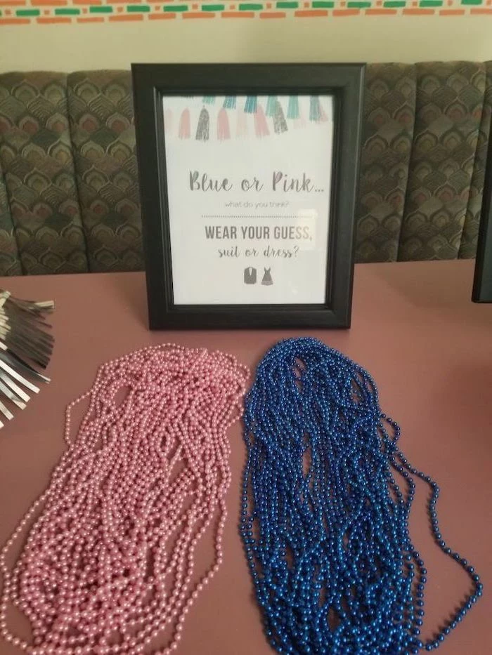 blue or pink, wear your guess, black frame, unique gender reveal ideas, pink and blue pearls