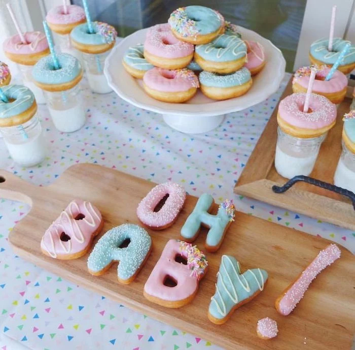 donuts and cookies, blue and pink frosting, gender reveal themes, oh baby, wooden trays