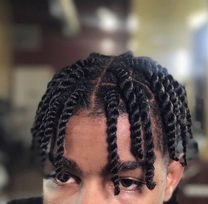man with black hair, braids for boys, blurred background, twisted braids