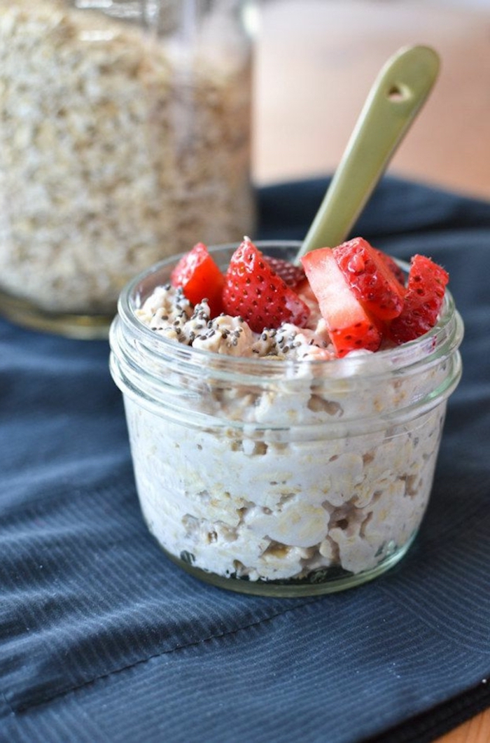 yoghurt and granola, with chia seeds, strawberry slices, best breakfast recipes, small spoon