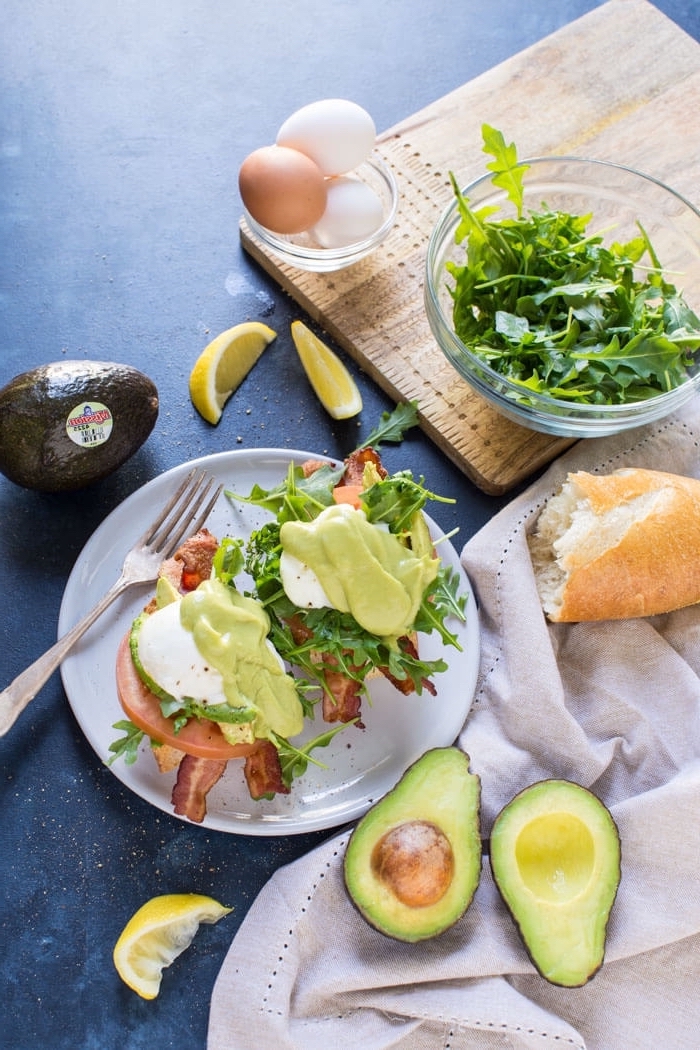 bruschetta with avocado, ham and green salad, what is brunch, halved avocado, lemon slices