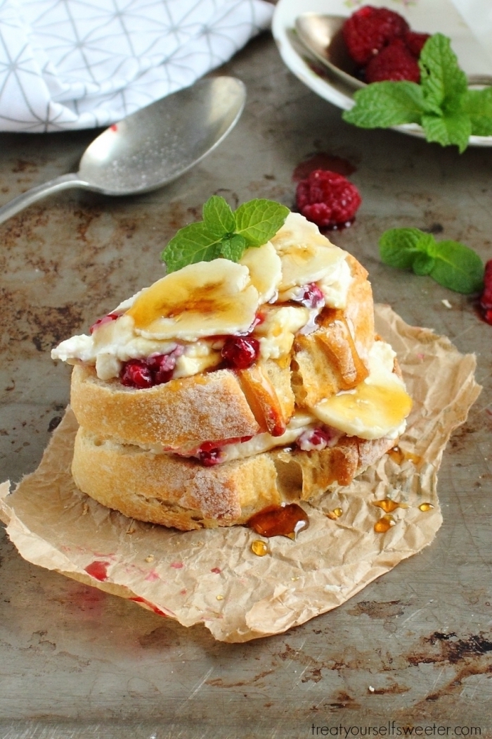 bruschetta with cream, pomegranate seeds, banana slices, what is brunch, granite countertop, mint leaves