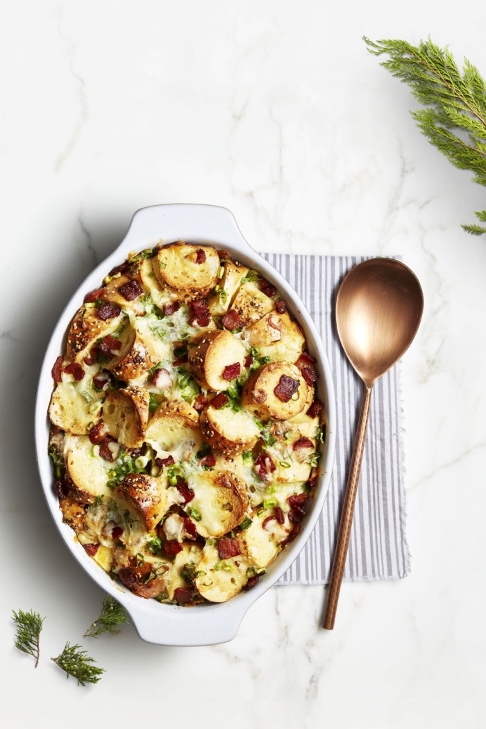 baked casserole, with bacon, brass spatula, breakfast dishes, marble countertop