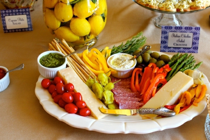 cheese platter, brunch menu ideas, cherry tomatoes, salami and olives, chopped peppers