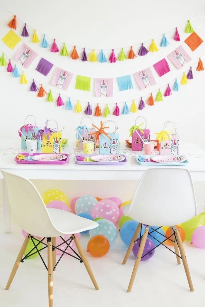 baby shower decorations, colorful decorations, white chairs, llama theme, colorful balloons, tassel garland
