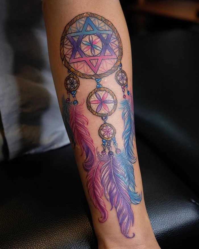 purple pink and blue colors, forearm tattoo, dreamcatcher meaning, black leather chair