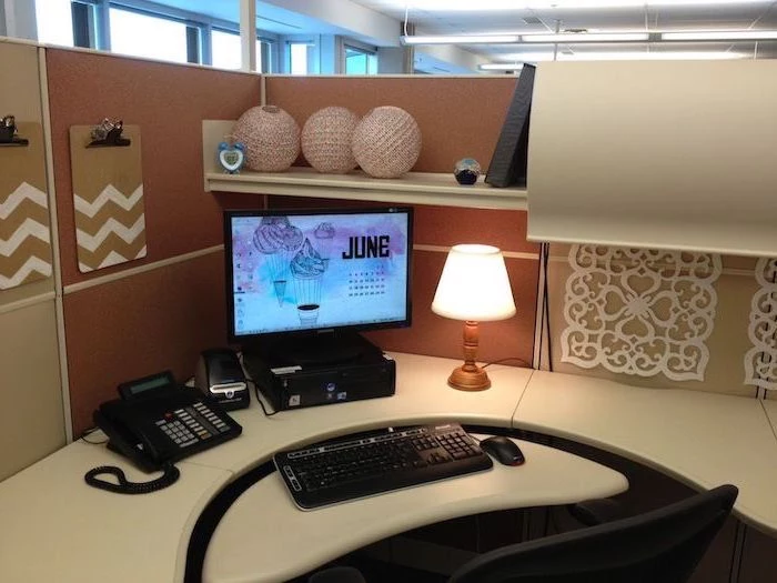 hanging folders, desktop computer, cubicle wallpaper, black chair, desk lamp