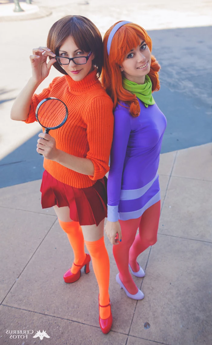 two women, dressed as daphne and velma, halloween costume ideas, scooby doo cartoon, inspired costumes