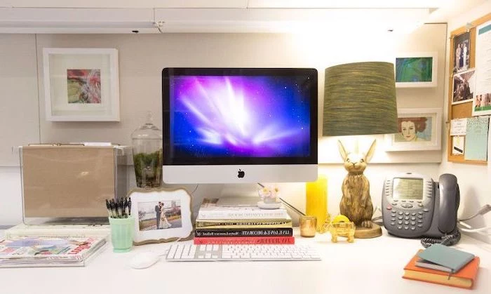 desktop computer, mens office decor, framed art, acrylic desk organiser, bunny lamp, framed photo