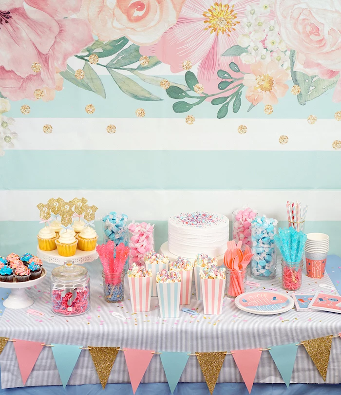gender reveal ideas, dessert table, with cake and cupcakes, sweet popcorn, different candies