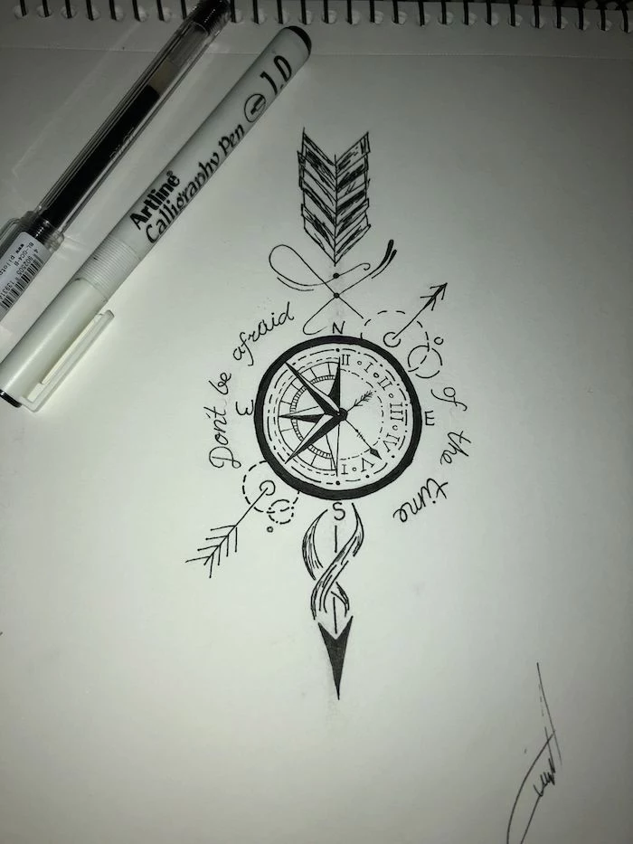don't be afraid of the time, small compass tattoo, black and white drawing, north and south, east and west
