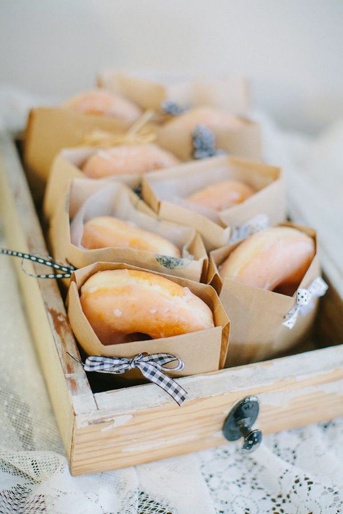 donuts in paper, white and black bows, in a wooden crate, easy brunch recipes