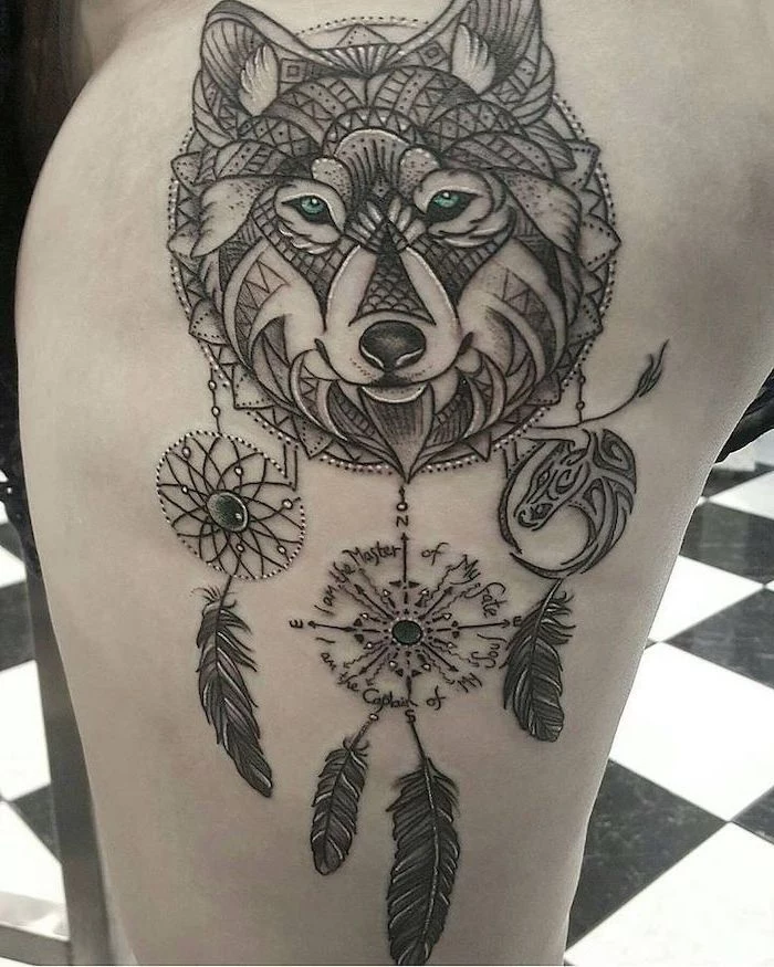 thigh tattoo, wolf dreamcatcher tattoo, black and white, tiled floor, inspirational quote