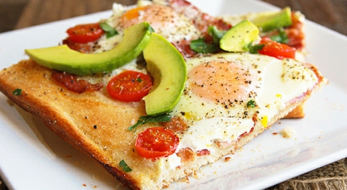 toast with eggs, sliced avocados, chopped cherry tomatoes, great breakfast ideas, white plate