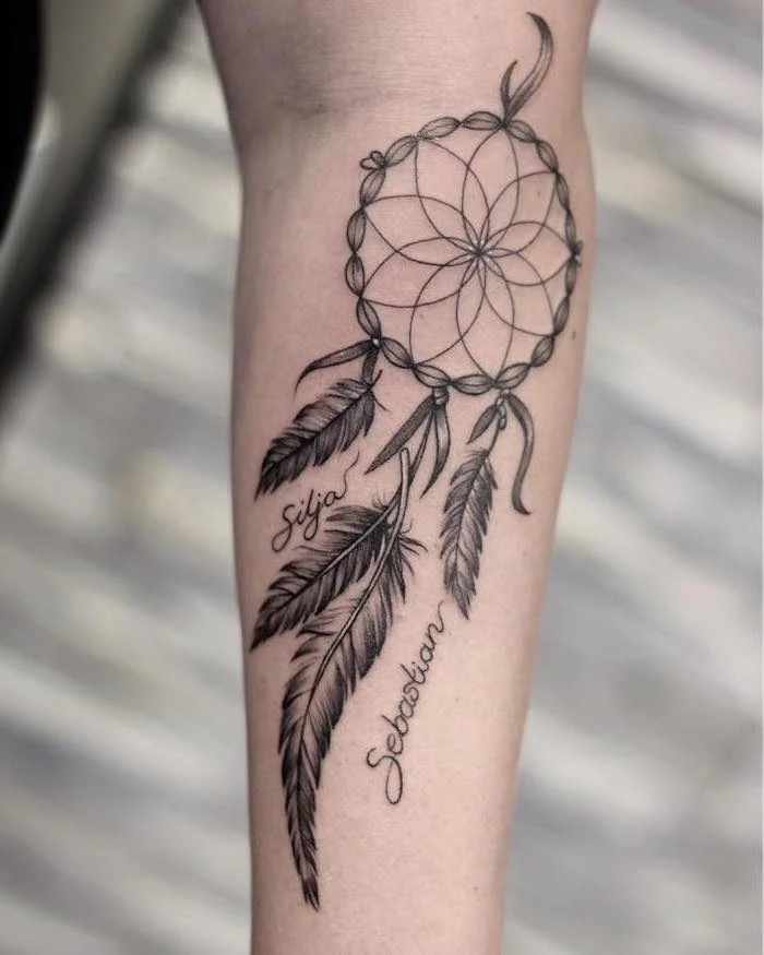 blurred background, silja and sebastian, dream catcher tattoo on thigh, forearm tattoo