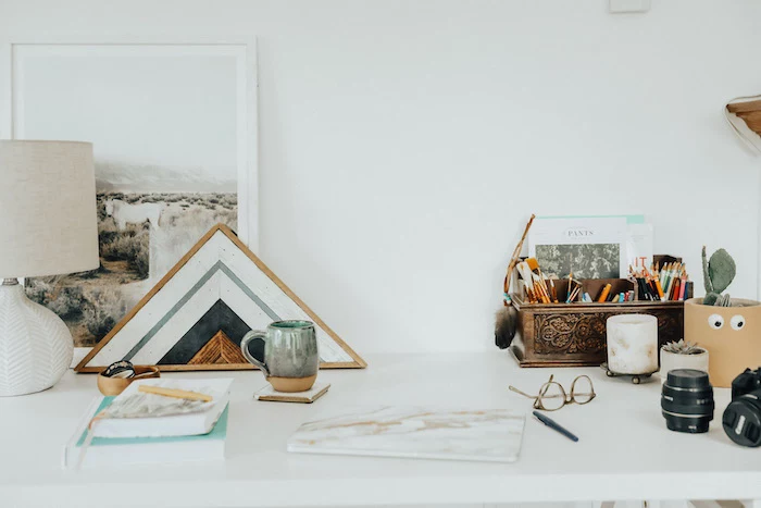 desk decor ideas, white wall, vintage pencil holder, on white desk, wooden desk organiser, notebooks and books