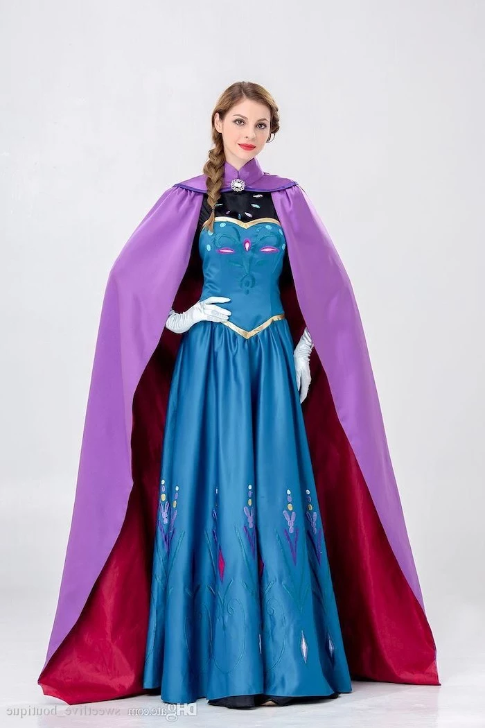woman dressed as anna, frozen inspired costume, blue dress, purple cape, halloween costume ideas for women