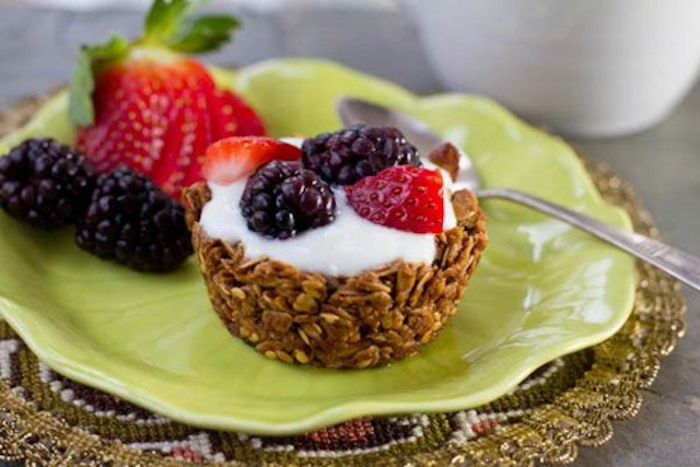 breakfast potluck, granola muffin, with cream, blackberries and strawberries, green plate