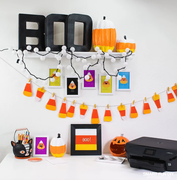 cute office decor, halloween decorations, ceramic pumpkins, black printer, pumpkin lanterns, fairy lights