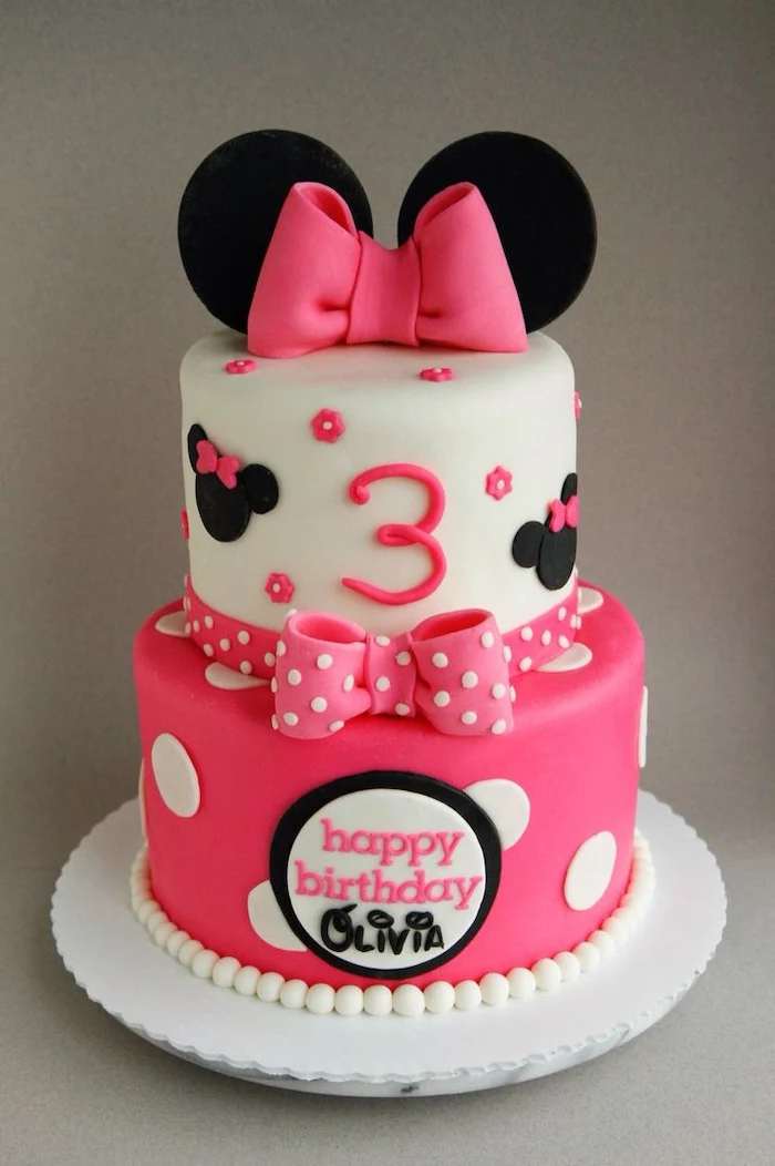 two tier cake, minnie cake, white and pink fondant, white cake tray, pink bows 