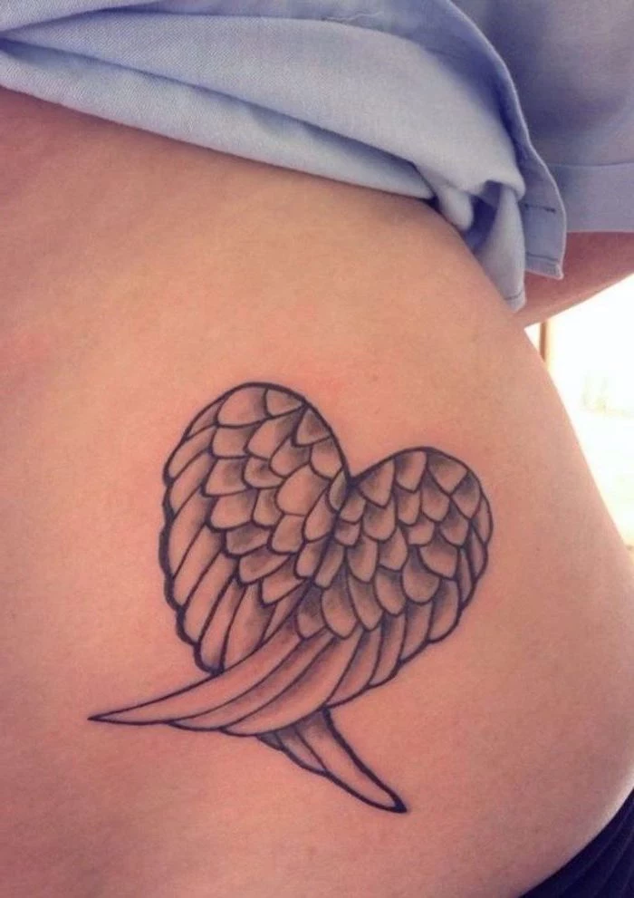 blue shirt, heart shaped, angel wings, angel wings tattoo on back, back tattoo