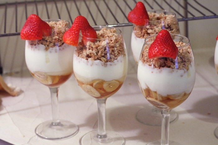 bananas and honey, yoghurt and granola, in wine glasses, breakfast potluck, chopped strawberries